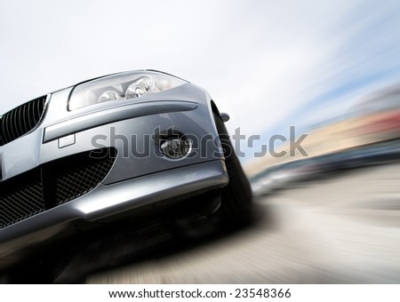 Fast generic vehicle with no logo moving with motion blur