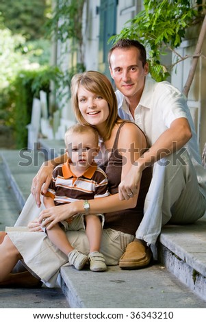 stock photo Happy perfect young family with dad mom and son outdoors 