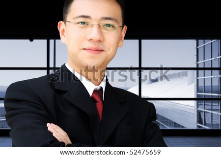 Handsome asian business man in suit at an airport