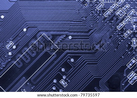Macro shot of a printed circuit board with details of connection and chip