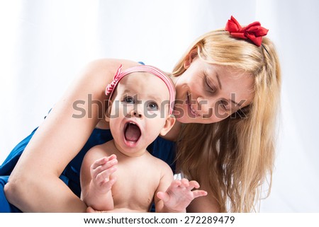 Mom playing with baby