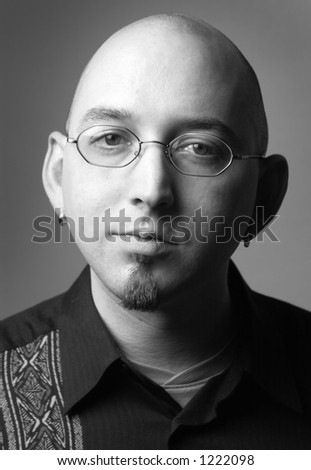 bald man with glasses and beard