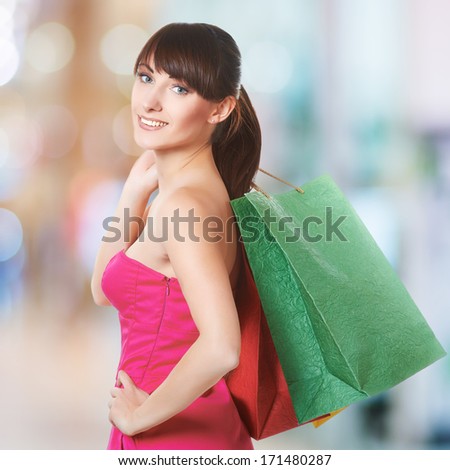 young lovely woman with shopping bags