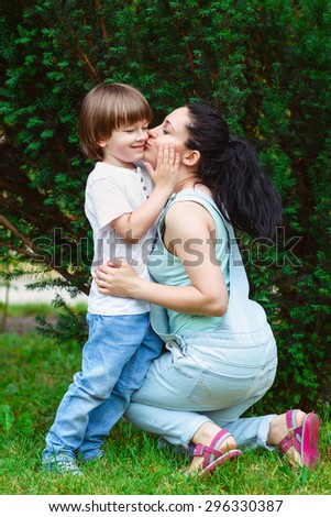 Loving mother kissing her son