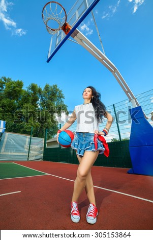 Rapper attitude rap singer hip Hop Dancer performing. Stylish woman posing at basketball court