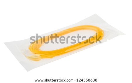 Surgical catgut suture material on a white background