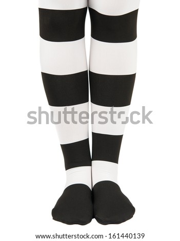 tights in black and white stripes on the legs girls isolated on white background