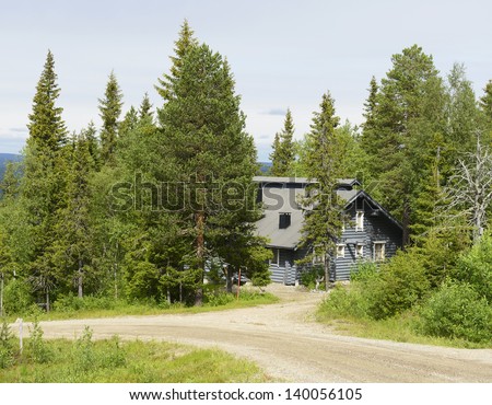 Gray cottage in the woods. Northern Finland