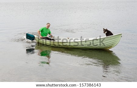 Travel around the lake on a boat with a dog