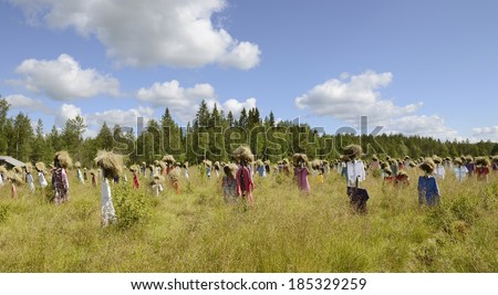 SUOMUSSALMI, FINLAND - JULY 26, 2012:Silent people is work of art by artist Reijo Kela. This work include about thousand scarecrow. Silent People moved to their present home in autumn of 1994.