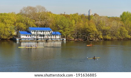 MOSCOW,RUSSIA - APR 27,2014:Russian teams trains on boats on Moscow River.Moscow River is river runs for about 400 miles through Russia.Picturesque river is   popular waterway for boats and cruises
