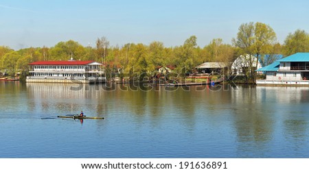 MOSCOW,RUSSIA - APR 27,2014:Russian teams trains on boats on Moscow River.Moscow River is river runs for about 400 miles through Russia.Picturesque river is   popular waterway for boats and cruises