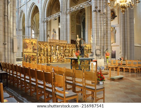 UPPSALA,SWEDEN - AUG 23,2014:Cathedral dates back to late 13th c and at height of 118.7 m.High altar is used for cathedral\'s services on most important feast days.Here all Swedish bishops are ordained