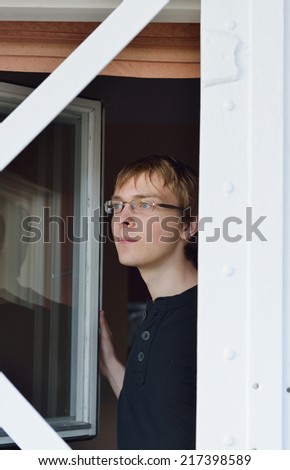 Young man in window