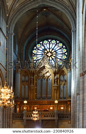 UPPSALA, SWEDEN - AUG 23,2014:Cathedral dates back to late 13th c and at height of 118.7 m. Main organ at west end was built in 1871 by Per Ekerman. It was rebuilt in 1939-1940, renovated in 1976