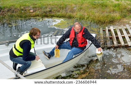 Travelers bailing out a sinking boat