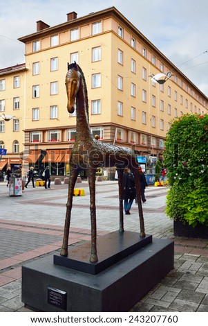 TURKU, FINLAND - AUGUST 27, 2014:Horse of Happiness is work of famous Finnish artist Rafael Saifulin. It\'s situated in Yliopistonkatu, in heart of Turku.