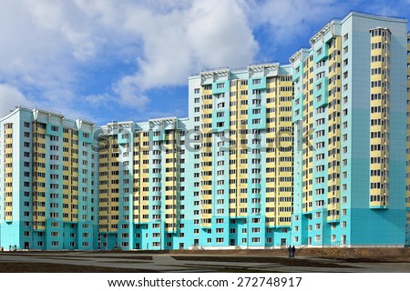 MOSCOW, RUSSIA - APRIL 22, 2015: Facade of new modern high-rise apartment buildings in Moscow on background of blue sky
