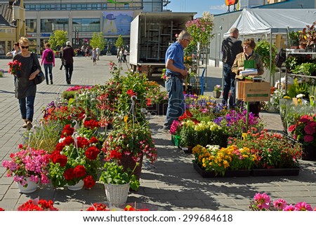KUOPIO, FINLAND - JUNE 29, 2015:Kuopio market place, situated directly in center of city, is one of finest attractions. It is a traditional venue for encounters, sales and happenings
