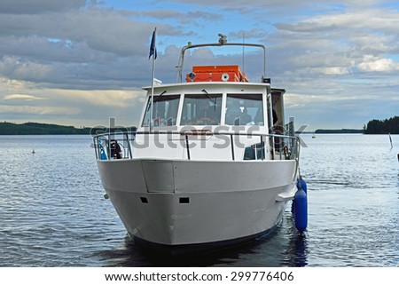 KUOPIO, FINLAND - JUNE 28, 2015: Kuopio is surrounded by lakes and natural thing to do in summer is to go on Lake Kallavesi sight seeing cruise. In the photo there is evening river trip