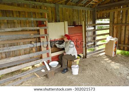 KUUSAMO,FINLAND - JULY 7,2015:Palosaari is farm where reindeer can be seen in paddock in summer and to see milking. Reindeer milk is one of most nutritious. It contains pure A- and D-vitamins, fat 20%