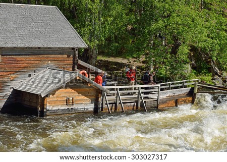 RUKA, FINLAND - JULY 7,2015:Old watermill at Myllykoski used to grind barley and rye until late 1940s. Today it serves as rest hut for hikers with open fireplace and scenic views of Myllykoski Rapids