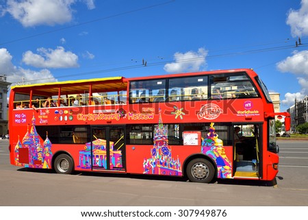 MOSCOW, RUSSIA - AUG 14, 2015: Bright red double-decker tour buses are prowling Moscow\'s streets, giving visitors great view of city centre. Hop On-Hop Off tour offers excursions in eight languages