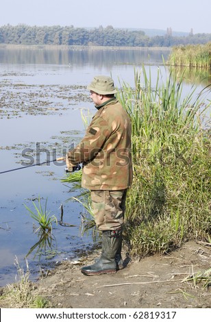 Fisherman would like to catch pikes with wobbler at Little-Lake Balaton,Hungary