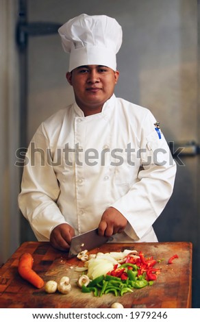 chef cutting vegetables looking from front