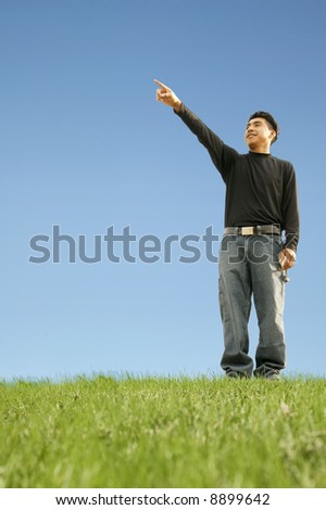 shot of a man pointing out representing pointing at future target or goal. with copyspace