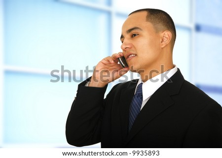 man making a phone call in his modern office hallway