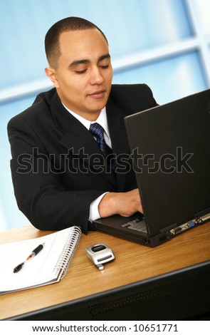 business man working with his laptop in contemporary office setting