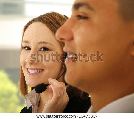 woman customer service look to camera while the business man smiling. concept for customer service
