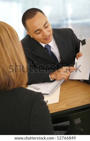 business man showing empty paper to business woman. concept for selling, meeting, consulting, or business related
