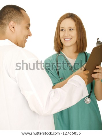 doctor and nurse holding clip board and discussing something on the clip board. concept for medical team