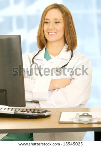doctor woman folding hand and watching computer screen with smile