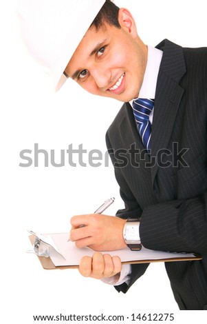 smiling contractor in suit and helmet, writing notes on clipboard.  isolated on white background