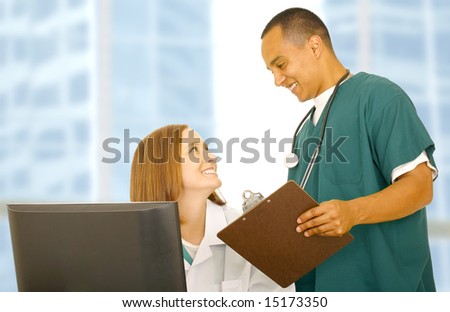 two medical staff interact or talking to each other showing happy expression. concept for medical team