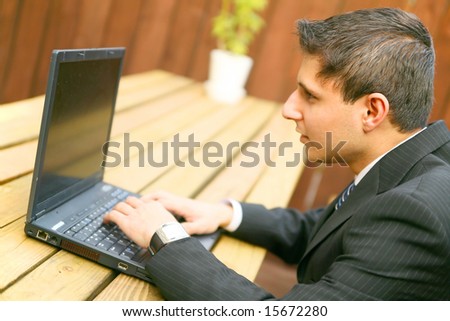 business man confused looking at his laptop outdoor