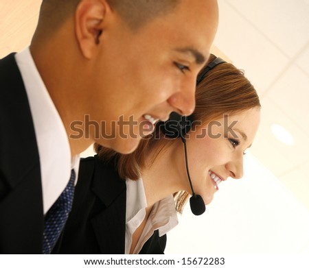 two business people looking to the side. the woman wearing headset talking to customer service. concept for customer service or customer care
