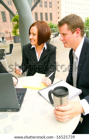 two business people, man and woman looking to other side and asking question