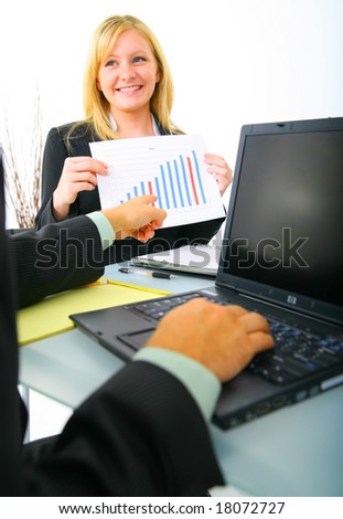 businesswoman showing financial chart to other coworker. concept for financial, business sales, and success