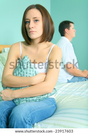caucasian young woman looking to viewer with sad expression over marriage trouble