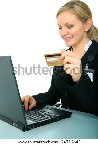 business woman holding credit card in front of computer. concept for online shopping