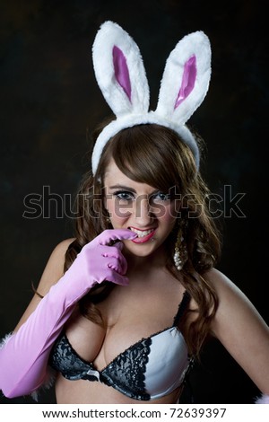 Cute young female in bunny outfit