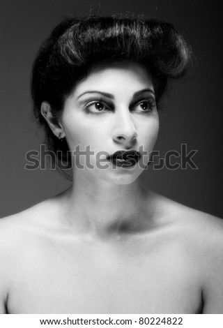 Black and white portrait of beautiful young woman isolated against white