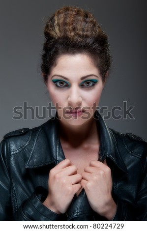 Beautiful young female in leather jacket