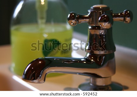 wash basin, hot tap and liquid soap