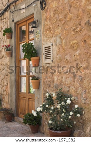 old spanish house with terracotta pots & wooden  door