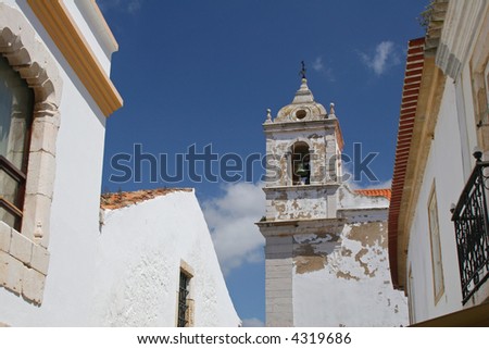 Old white church building with bell tower